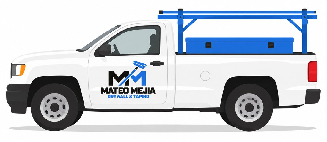 White Mateo Mejia Drywall & Taping work truck with a blue ladder rack